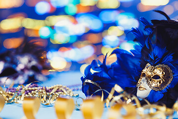 Image showing Traditional female carnival venetian mask on bokeh background. Masquerade, Venice, Mardi Gras, Brazil concept