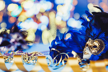 Image showing Traditional female carnival venetian mask on bokeh background. Masquerade, Venice, Mardi Gras, Brazil concept