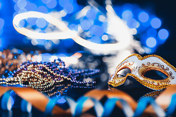 Image showing Traditional female carnival venetian mask on bokeh background. Masquerade, Venice, Mardi Gras, Brazil concept