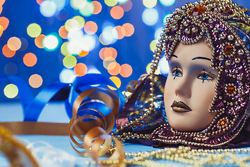 Image showing Traditional female carnival venetian mask on bokeh background. Masquerade, Venice, Mardi Gras, Brazil concept