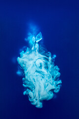 Image showing Abstract pattern falling into the water drop of blue ink - cyan ink dissolved in water