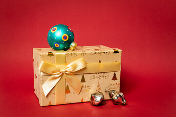 Image showing Christmas gift box on red background