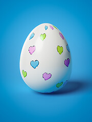 Image showing easter egg with hearts on blue background
