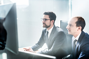 Image showing Business team analyzing data at business meeting in modern corporate office.