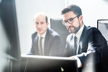 Image showing Business team analyzing data at business meeting in modern corporate office.