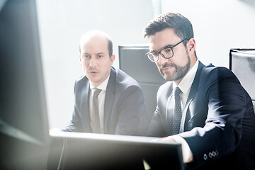 Image showing Business team analyzing data at business meeting in modern corporate office.