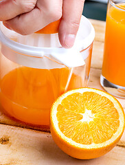 Image showing Freshly Squeezed Juice Shows Healthy Orange Drink And Drinking 