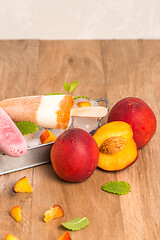 Image showing Homemade raspberries and peach popsicles