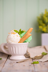 Image showing Vanilla and mint ice cream in cup