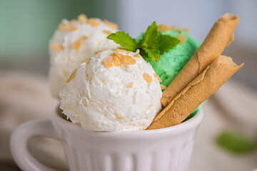 Image showing Vanilla and mint ice cream in cup