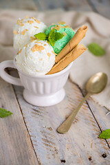 Image showing Vanilla and mint ice cream in cup