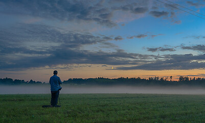 Image showing Photographer in a fog field