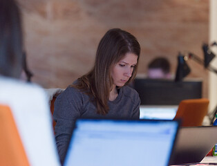 Image showing businesswoman using a laptop in startup office