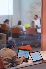 Image showing businesswoman using a laptop in startup office