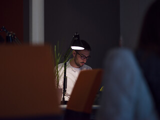 Image showing businessman working using a laptop in startup office