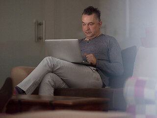 Image showing businessman working using a laptop in startup office