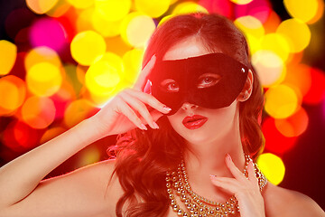 Image showing Beauty model woman wearing venetian masquerade carnival mask at party