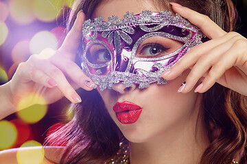 Image showing Beauty model woman wearing venetian masquerade carnival mask at party