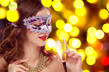 Image showing Beauty model woman wearing venetian masquerade carnival mask at party