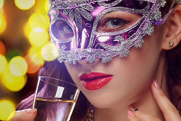 Image showing Beauty model woman wearing venetian masquerade carnival mask at party