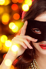 Image showing Beauty model woman wearing venetian masquerade carnival mask at party