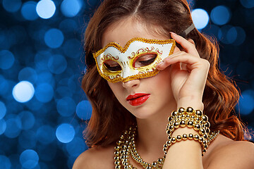 Image showing Beauty model woman wearing venetian masquerade carnival mask at party