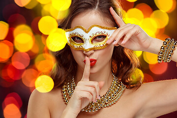 Image showing Beauty model woman wearing venetian masquerade carnival mask at party