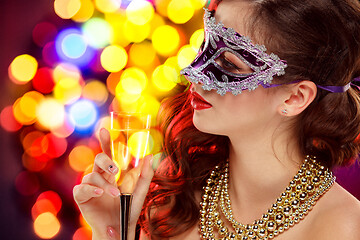 Image showing Beauty model woman wearing venetian masquerade carnival mask at party