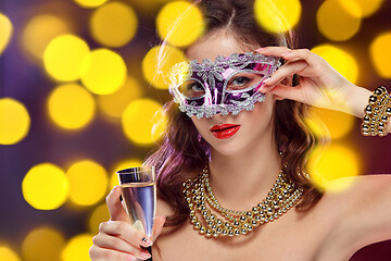 Image showing Beauty model woman wearing venetian masquerade carnival mask at party