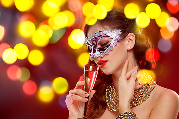 Image showing Beauty model woman wearing venetian masquerade carnival mask at party