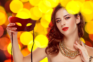 Image showing Beauty model woman wearing venetian masquerade carnival mask at party