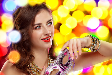 Image showing Beauty model woman wearing venetian masquerade carnival mask at party