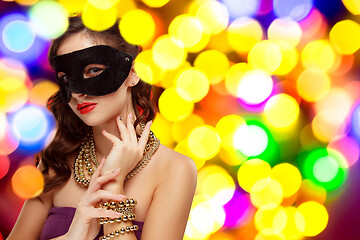 Image showing Beauty model woman wearing venetian masquerade carnival mask at party