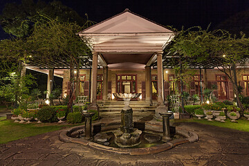 Image showing Old classic style vintage home with veranda and garden