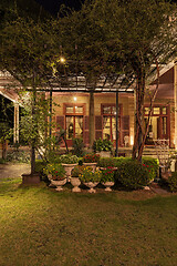 Image showing Old classic style vintage home with veranda and garden