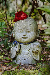 Image showing Jizo stone statue wearing knitted and cloth hats.