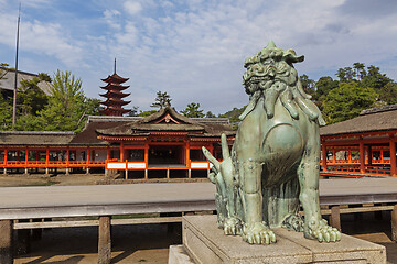 Image showing Bronze statue of Komainu traditional japanese guardian lion dog, in Itsukushima Shrine in Japan.