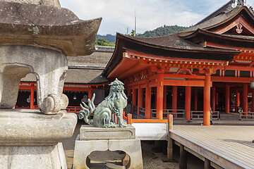 Image showing Bronze statue of Komainu traditional japanese guardian lion dog, in Itsukushima Shrine in Japan.