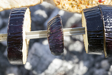 Image showing Cooking eggplant on fire