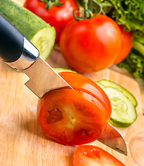 Image showing Cutting Tomato Represents Vegetarian Salads And Wellness 