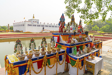 Image showing Buddha birthplace in Lumbini and buddhist offerings 