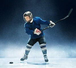 Image showing Little boy playing ice hockey