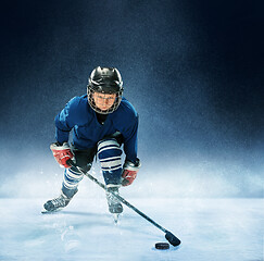 Image showing Little boy playing ice hockey