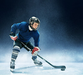 Image showing Little boy playing ice hockey