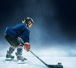 Image showing Little boy playing ice hockey