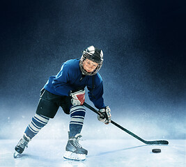 Image showing Little boy playing ice hockey