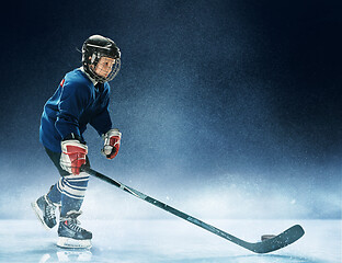 Image showing Little boy playing ice hockey