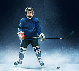 Image showing Little boy playing ice hockey