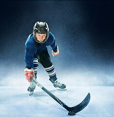 Image showing Little boy playing ice hockey