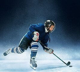 Image showing Little boy playing ice hockey